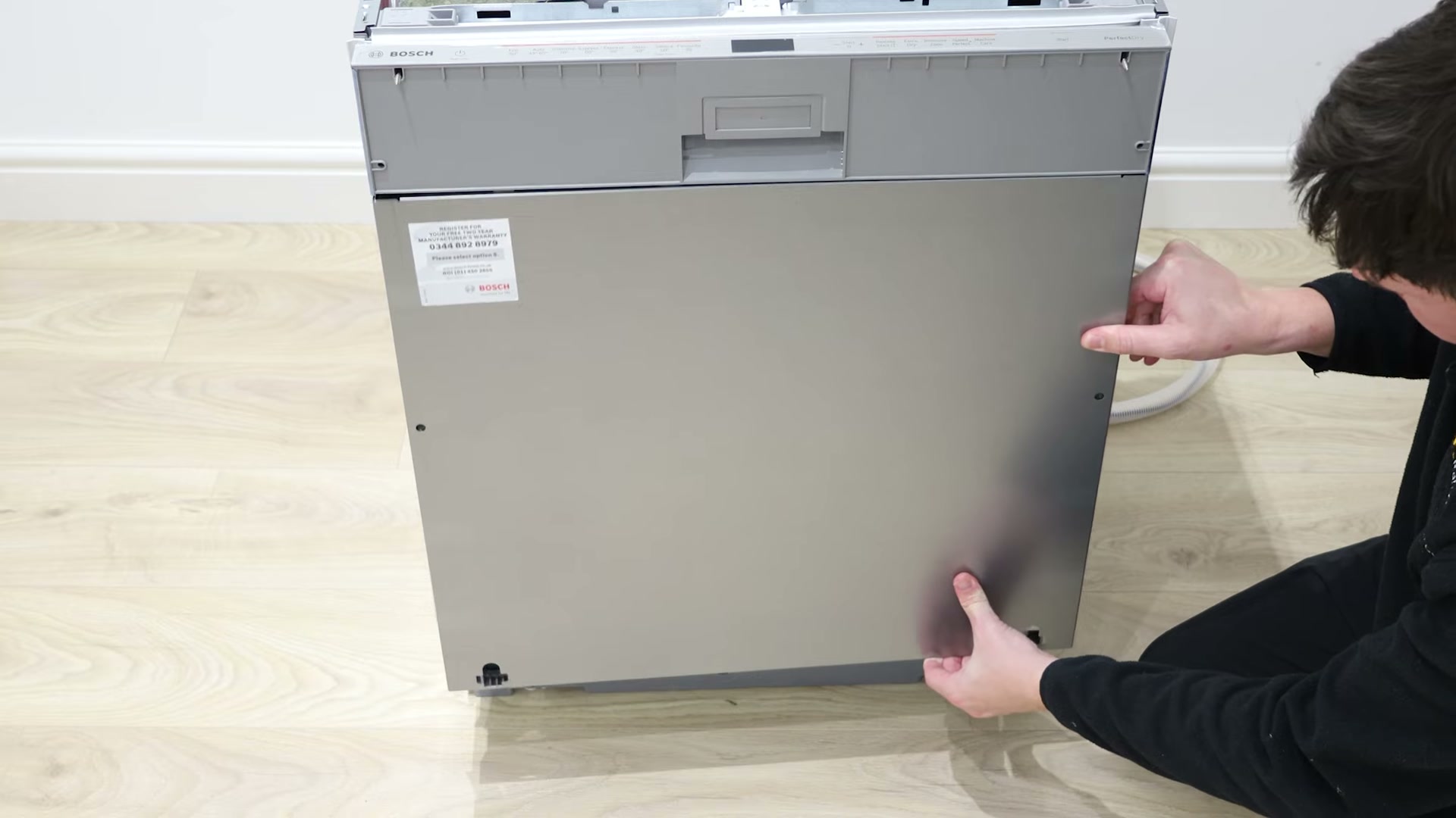 Refitting the outer front door panel onto a Bosch dishwasher