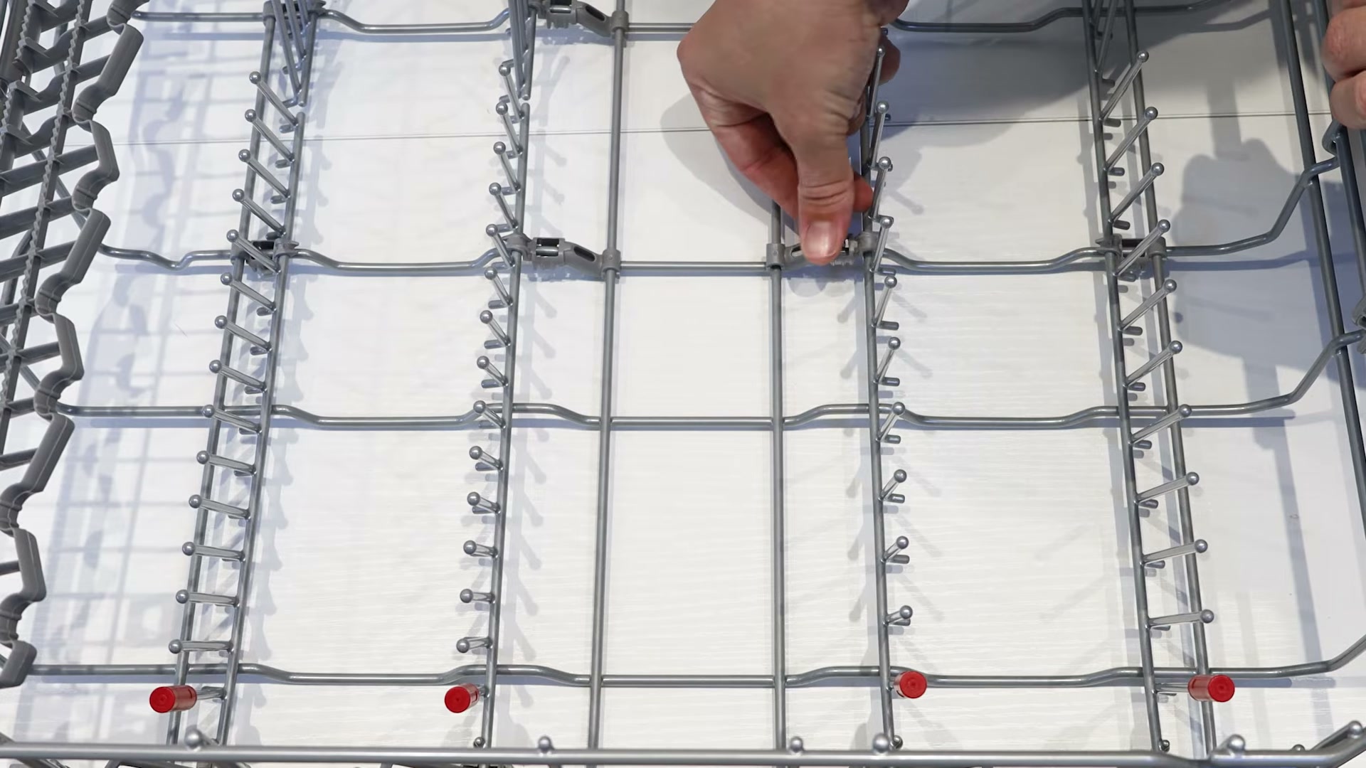 Fitting a new clip onto the lower basket wireframe of a Bosch dishwasher