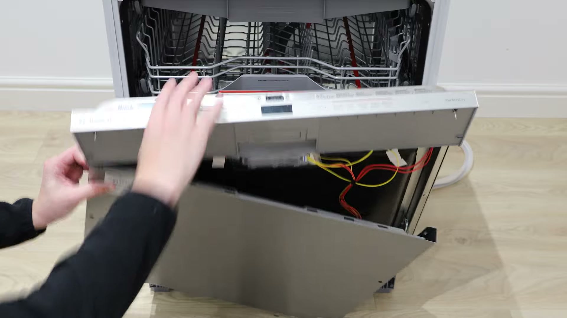 Sliding the old outer front door panel away from a Bosch dishwasher