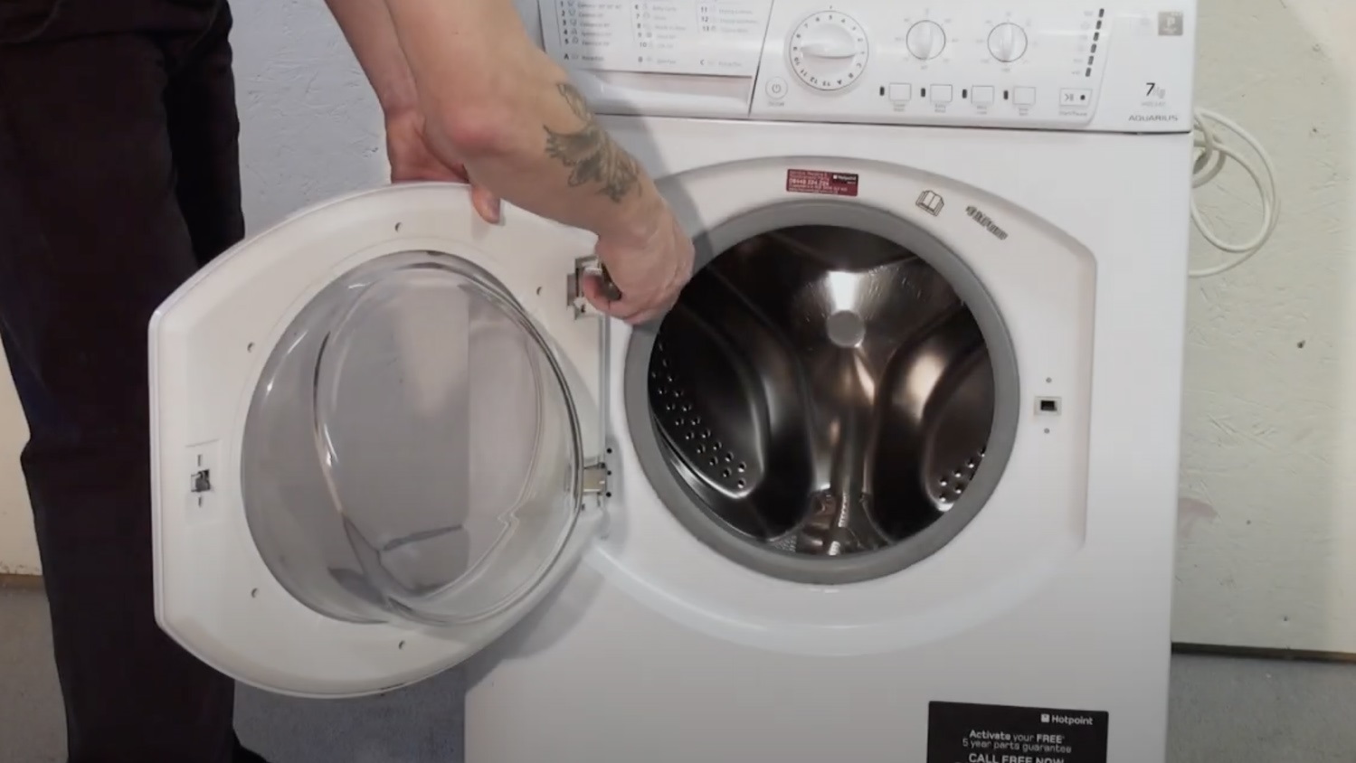 Remove screws from washing machine door