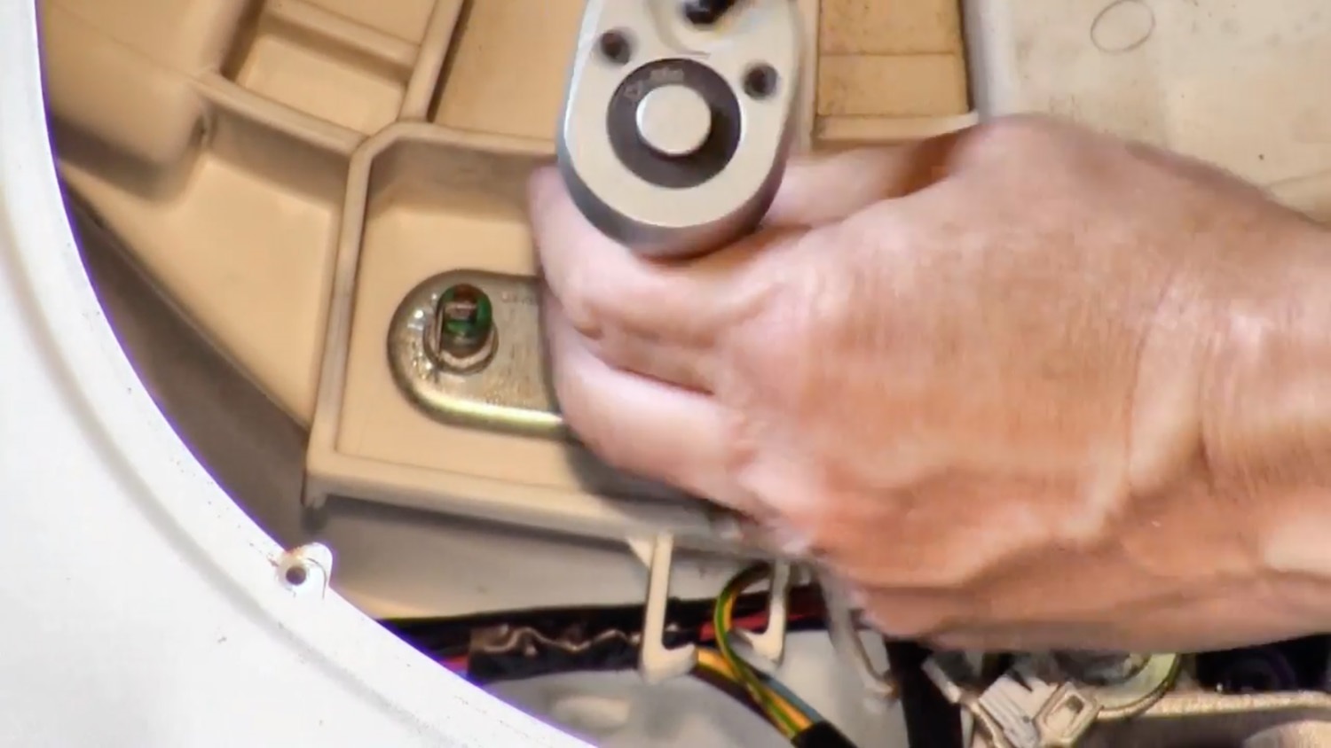 Using a wrench, undo the nut