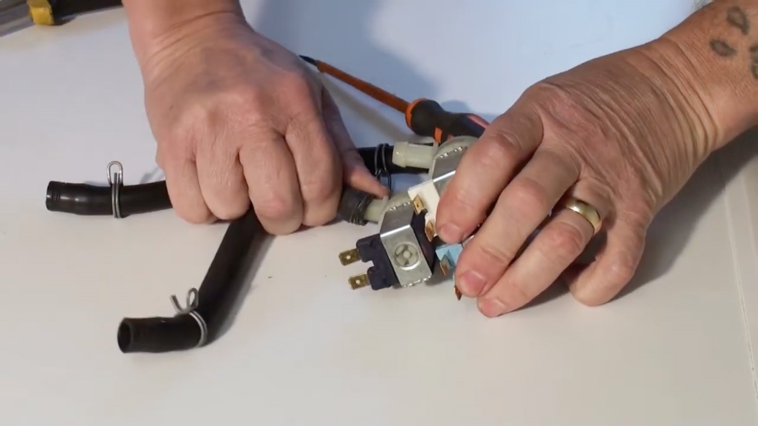 Remove hoses from old valve