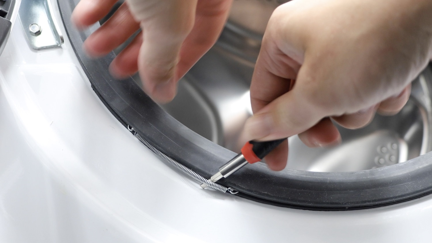 Remove front clamping spring